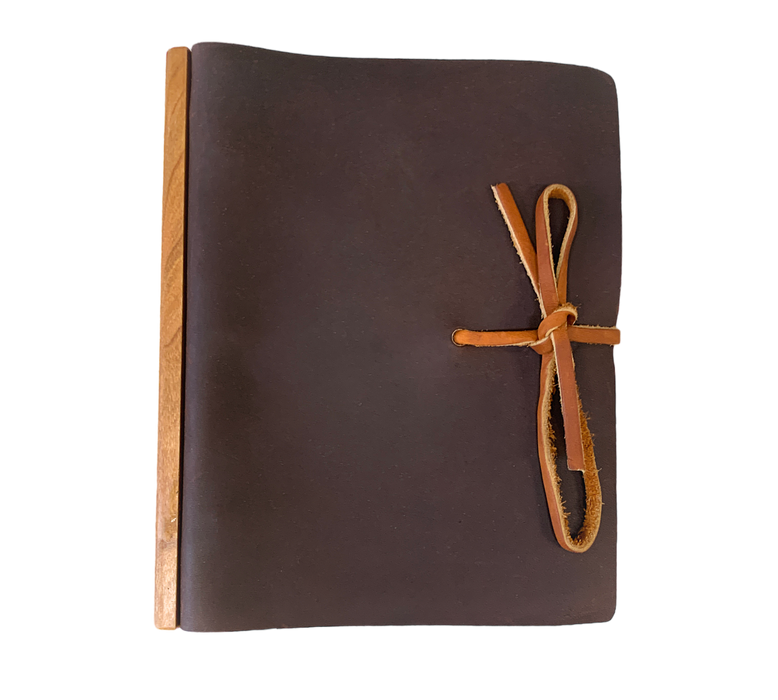 This Large Tie Leather Journal with Ring Binder unites modernity and rusticity with practicality. Meticulously handcrafted from full grain leather that is softened and textured, and augmented with a wooden band along the binding, the journal promotes an opulent writing or note-taking affair. The ring binder's robustness ensures that your notes and works remain securely stored. An exquisite and perpetual piece fit for any connoisseur.