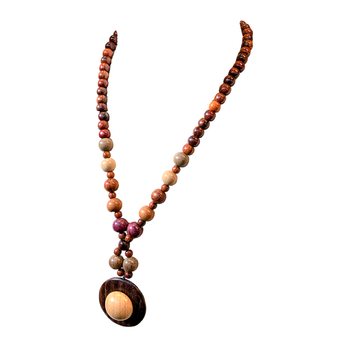 Necklace Elizabeth featuring assorted exotic woods, handmade and 22 inches long, perfect for dressing up a sweater.