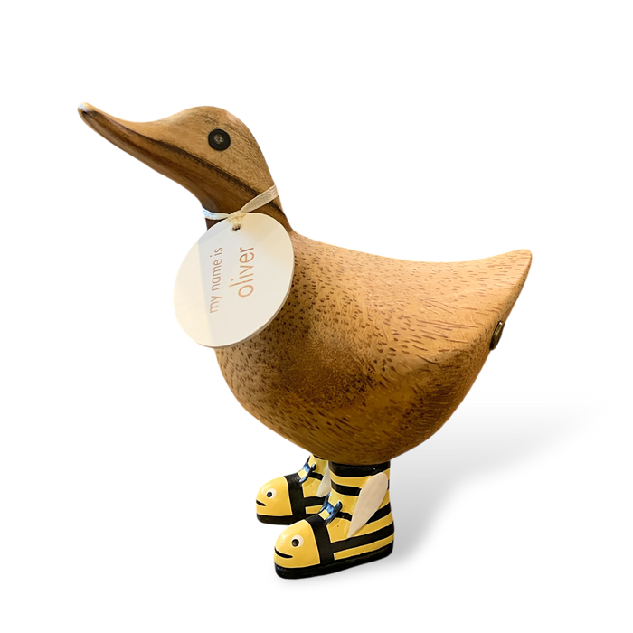 Cute wooden duck with name tag wearing bumblebee-patterned boots.