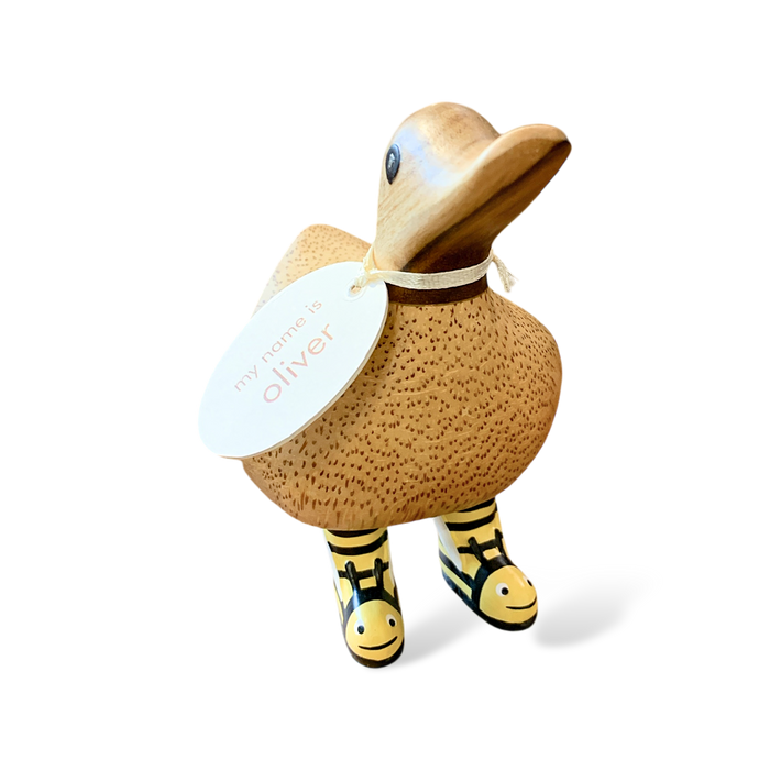 Handcrafted wooden duck with name tag and yellow bumblebee boots