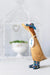 DCUK blue duckling with a delicate floral hat and country-style boots