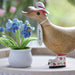 DCUK wood duck with a carnation flower hat and matching wooden boots, handmade decorative duck figurine.