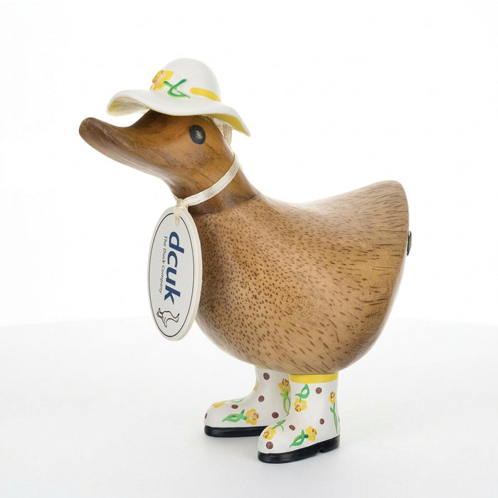 DCUK wood duckling with daffodil flower hat and boots, handmade wooden duck gift, detailed natural wood finish.