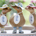 Handmade DCUK wood duck with forget-me-not flower hat and matching wooden boots, a charming decorative wooden gift.