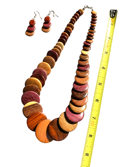 Handmade exotic wood necklace with overlapping discs in Purple Heart, Pau Amarillo, Cocobolo, shown with matching earrings and measuring tape