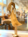 Handcrafted bamboo root life-size wooden duck statue in a whimsical pose displayed on a table in a bright, cozy room