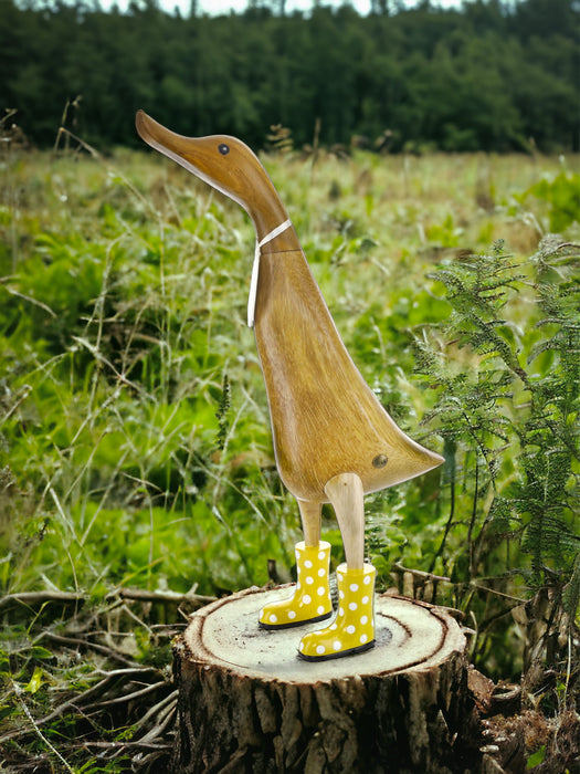 DCUK Ducklet wooden figure wearing yellow spotty rain boots
