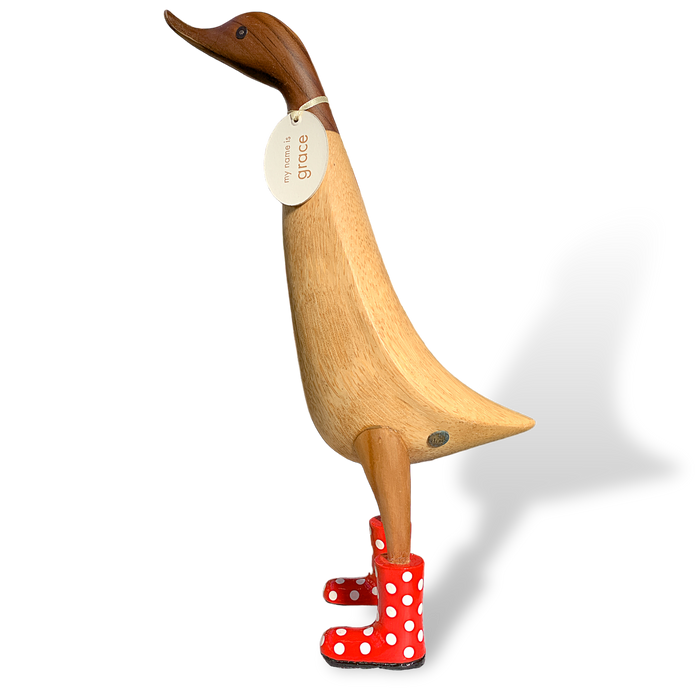 DCUK Ducklet wooden collectible wearing red spotted rain boots