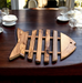 Durable olive wood trivet perfect for kitchen or gift.