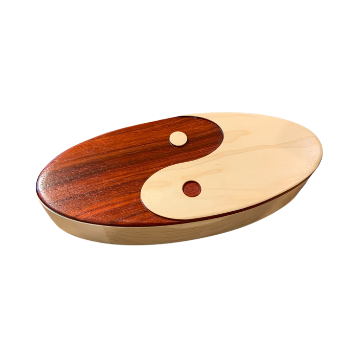 Wooden yin yang keepsake box with smooth polished finish made from african padauk and maple hardwoods.