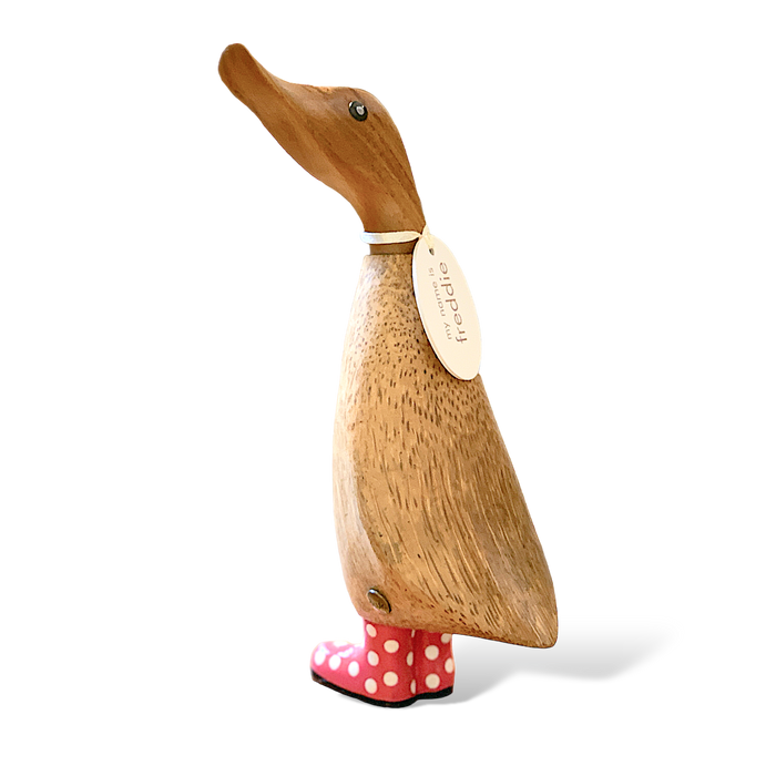 Handcrafted bamboo and teak wood duckling wearing red spotty boots and an oval name tag, perfect for whimsical home decor