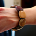 Exotic wood bracelet with rounded beads, featuring natural warm colors and a durable stretch cord for versatile wear.