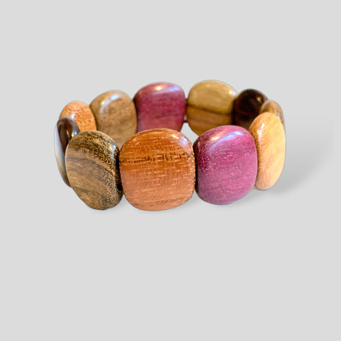 Exotic wood bracelet with rounded beads in vibrant natural colors on a durable stretch cord.