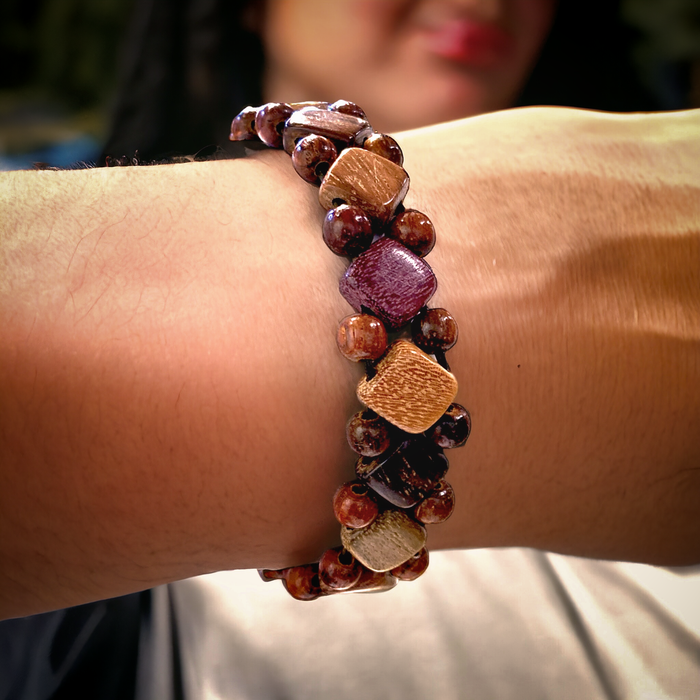 Close-up of a Wood Diamond and Bead Stretch Bracelet on a wrist. The bracelet features natural-colored wooden diamonds and beads in a stylish design.