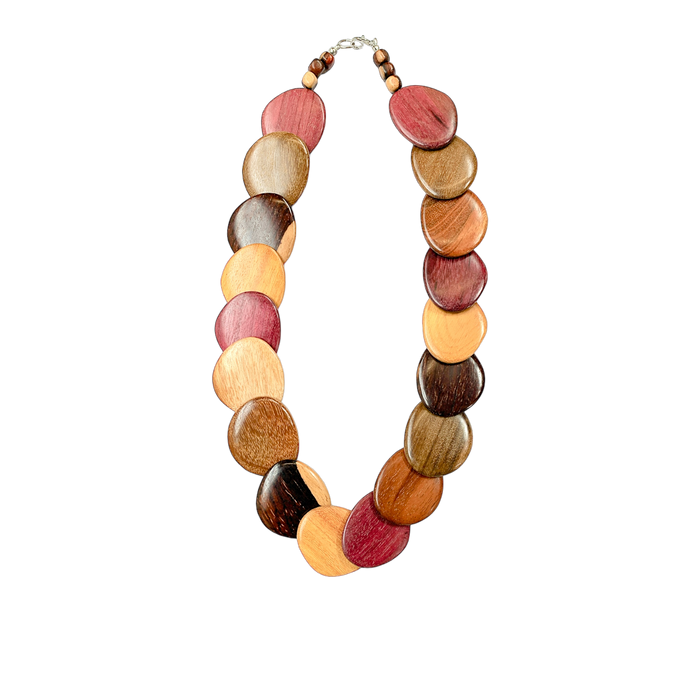 Colorful wood necklace with assorted wood tones in circular shapes forming a stylish and unique accessory
