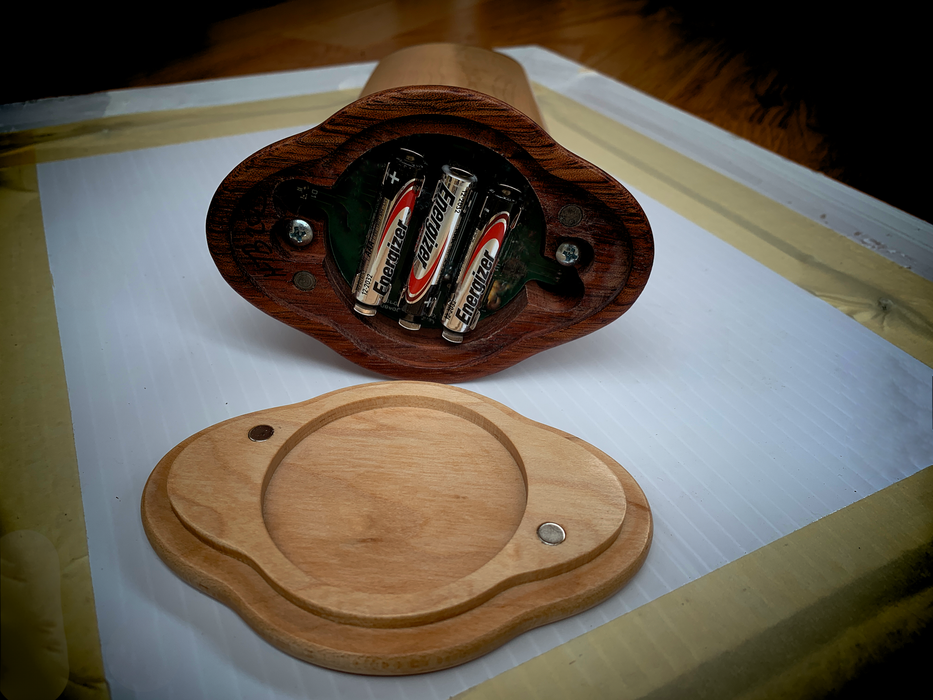 Exposed base of the Turniton Kaleidoscope with magnetized cover for easy battery access. No screws required.