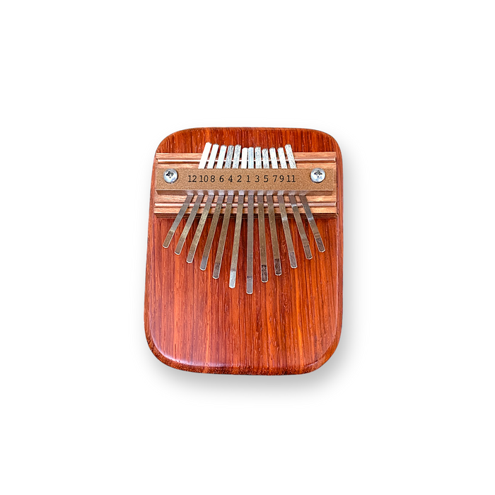 Kalima a musical instrument handmade from   flaming  african padauk wood.