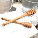 Natural olive wood honey stick, perfect for controlled honey drizzle