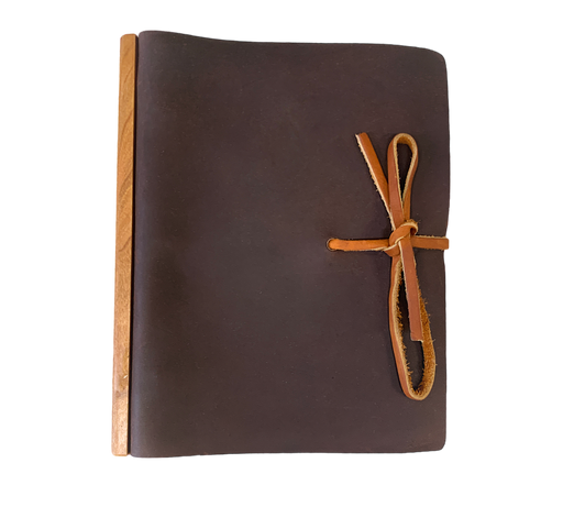 This Large Tie Leather Journal with Ring Binder unites modernity and rusticity with practicality. Meticulously handcrafted from full grain leather that is softened and textured, and augmented with a wooden band along the binding, the journal promotes an opulent writing or note-taking affair. The ring binder's robustness ensures that your notes and works remain securely stored. An exquisite and perpetual piece fit for any connoisseur. 