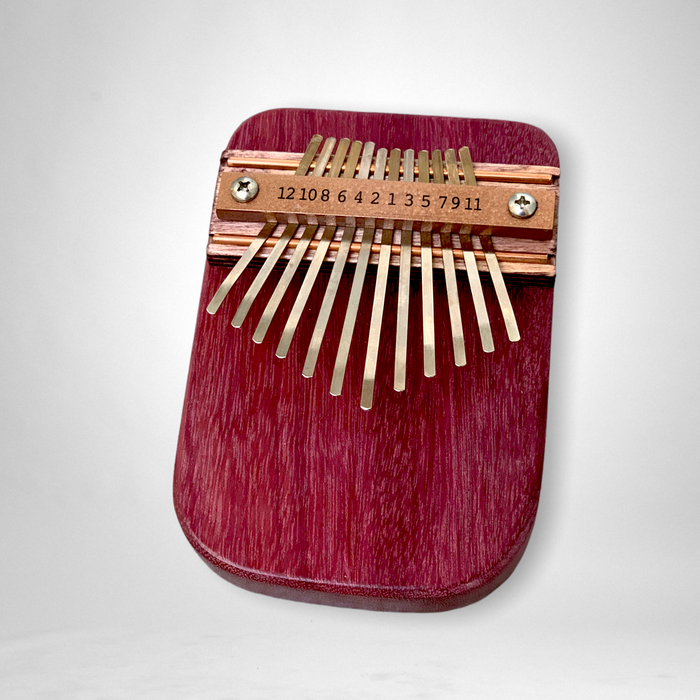 A 12-Note Thumb Piano otherwise know as Kalimba made from purpleheart wood. 