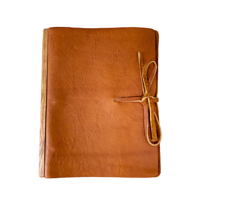 Soft tan colored full grain leather journal handmade in  Michigan. Parchment paper pages. 
