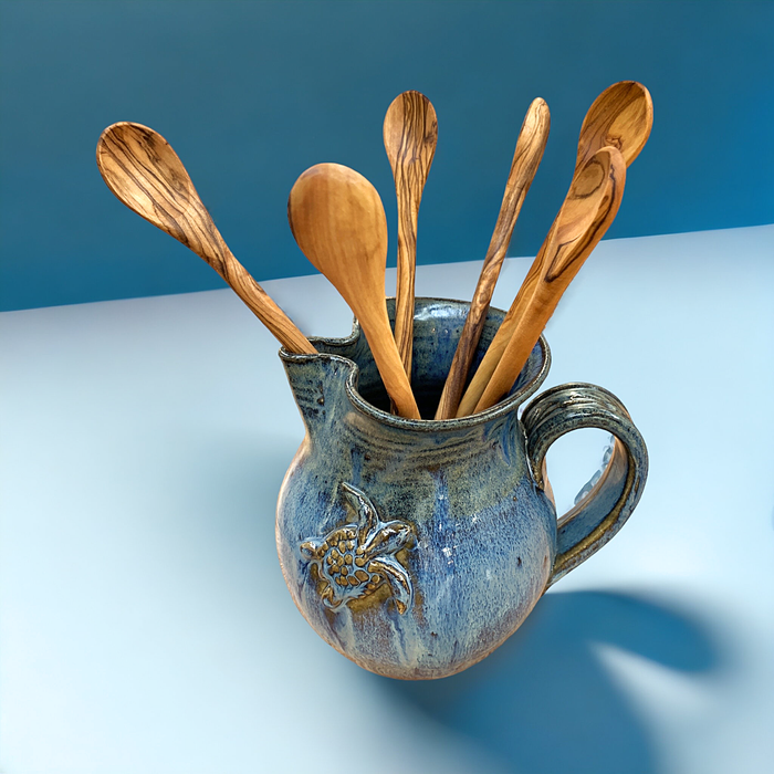 Olive Wood Tating Spoons in Blue Turtle Pitcher. Pottery made by Mark Koepnick of North Carolina Potter. 