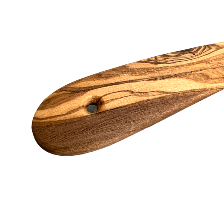 olive wood ladle handle with hole for wall display.